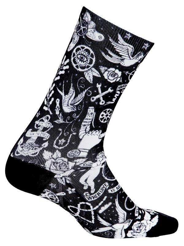Black cycling sock with white tattoo-style designs including roses, birds, anchors, and peace signs