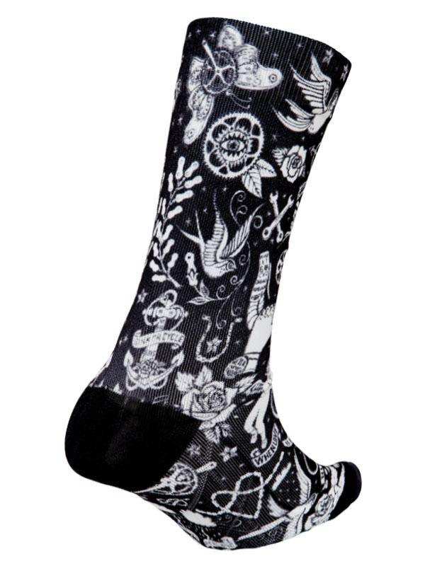 Black cycling sock with white tattoo-style designs including birds, roses, and anchors