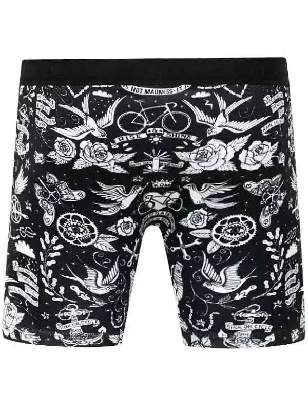 Black cycling boxer briefs with white tattoo-style graphics including bikes, roses, and birds