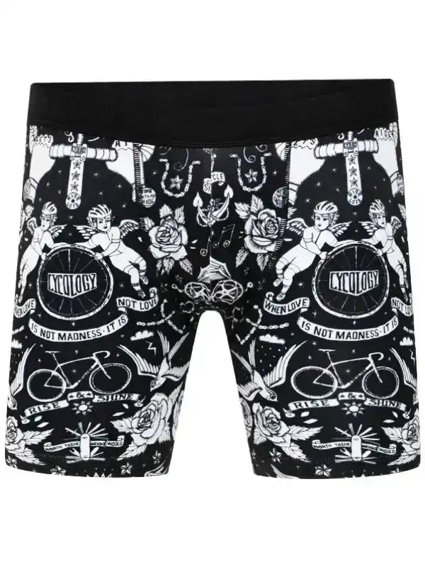 Black cycling shorts with white tattoo-style graphics, cherubs, roses, and bikes for men or women
