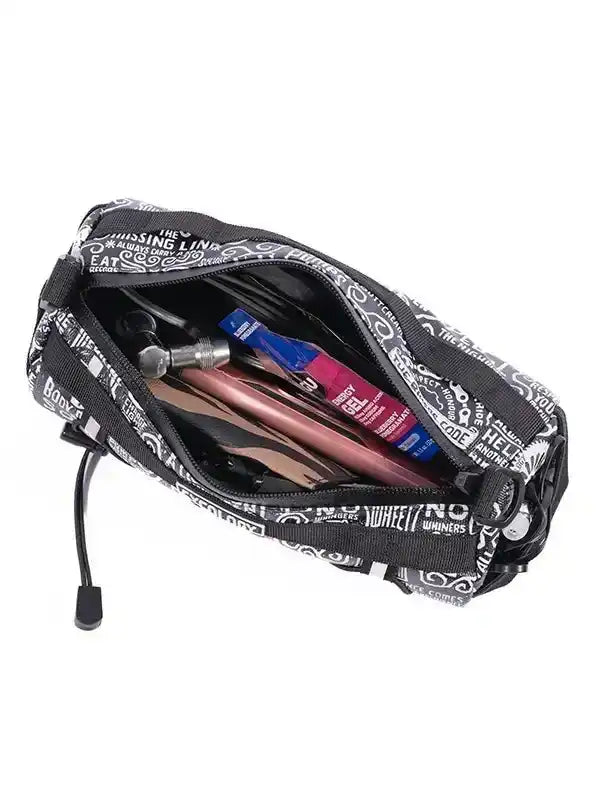 Black cycling accessory bag with white text print, holding tools and energy gel, ideal for bike rides